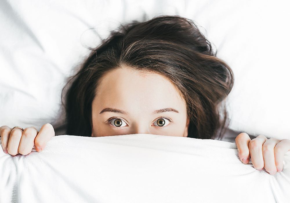 girl under blanket